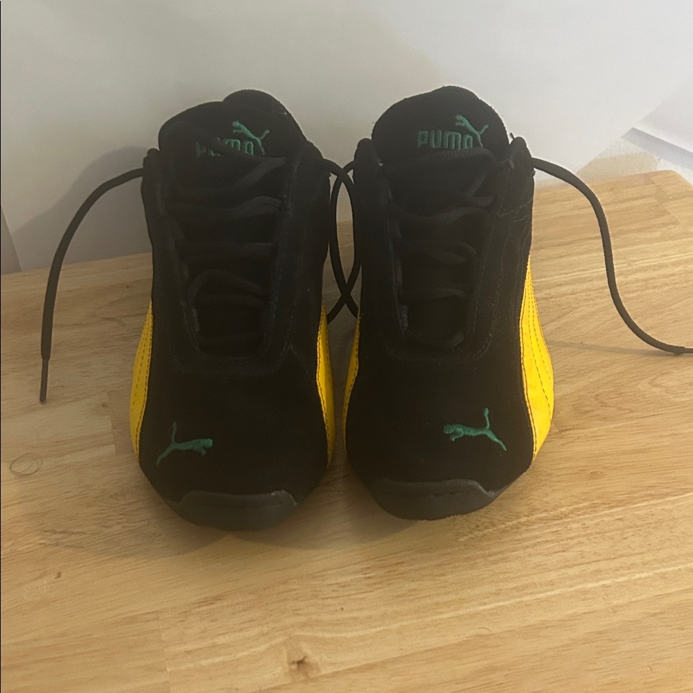 Puma Black and Gold Sneakers